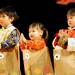 From left:  5-year-old Enlih Wang, 3-year-old Felicia Lin, and 3-year-old Gina Lin dance to the song "Fish in the water the fish swim." Angela J. Cesere | AnnArbor.com
