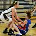 Dexter's Polly Washabaugh, left, wrestles for the ball with Lincoln Park's Paige Llanes. Angela J. Cesere | AnnArbor.com