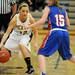 Dexter's Lindsey Lloyd, left, looks for a way around Lincoln Park's Paige Llanes. Angela J. Cesere | AnnArbor.com