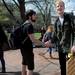 University of Michigan sophomore David Brownman, left, stands frozen in place while shaking hands with University of Michigan freshman Carlie Engelman on the University of Michigan Diag in Ann Arbor, Mich. on March 28, 2012. They were participants in an event organized by the student group Do Random Acts of Kindness which called for participants to freeze in place for 5 minutes, starting at 2:33pm. Angela J. Cesere | AnnArbor.com