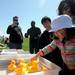 Ann Arbor resident Ann Bell holds onto her daughter, Abigail Bell-Collins, age 2, as she picks up a duck to see what prize she won at Ann Arbor Jaycees Spring Eggstravaganza at Southeast Area Park in Pittsfield Township. Angela J. Cesere | AnnArbor.com