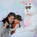 Ann Arbor resident Teresa Hatcher holds up her daughter, Paige, age 2, and points to the camera to get a photo with the Easter Bunny during the Ann Arbor Jaycees Spring Eggstravaganza at Southeast Area Park in Pittsfield Township. Angela J. Cesere | AnnArbor.com
