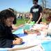 Ypsilanti resident Maya Rollins, age 5, left, colors an Easter basket drawing during the Ann Arbor Jaycees Spring Eggstravaganza at Southeast Area Park in Pittsfield Township. Angela J. Cesere | AnnArbor.com
