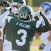 Eastern Michigan defensive back Willie Williams flexes his muscles after Eastern tackled Buffalo. Angela J. Cesere | AnnArbor.com