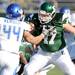 Eastern Michigan linebacker Justin Cudworth blocks Buffalo linebacker Jaleel Verser. Angela J. Cesere | AnnArbor.com