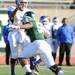 Eastern Michigan defensive lineman Andy Mulumba (56) runs down Buffalo quarter back Chazz Anderson. Angela J. Cesere | AnnArbor.com