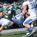 Eastern Michigan quarter back Alex Gillett dodges around Buffalo linebacker Jaleel Verser (44). Angela J. Cesere | AnnArbor.com