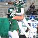Eastern Michigan offensive lineman Scott MacLeod, left, lifts wide receiver Demarius Reed after Reed scored a touchdown against Buffalo.  Angela J. Cesere | AnnArbor.com