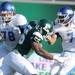 Eastern Michigan defensive lineman Andy Mulumba runs down Buffalo quarter back Chazz Anderson. Angela J. Cesere | AnnArbor.com