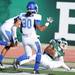 Buffalo defensive back Cortney Lester, left, and defenisve back Okoye Houston watch as Eastern Michigan wide receiver Demarius Reed catches a touchdown pass. Angela J. Cesere | AnnArbor.com