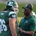 Eastern Michigan head coach Ron English talks with offensive lineman Bridger Buche during a time-out. Angela J. Cesere | AnnArbor.com