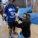 Romulus resident Michelle Bilicki, right, helps put a climbing harness on her son, Joe Bialek, age 12, for the First Climb event sponsored by the University of Michigan Orthotics and Prosthetics Center and the U-M Community Amputee Network at Planet Rock in Ann Arbor. Angela J. Cesere | AnnArbor.com