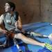 Ronnie Dickson, the First Climb instructor, attaches an adaptive climbing shoe to the prosthetic leg of Greenville, Ohio, resident Molly French during the First Climb event at Planet Rock.  Angela J. Cesere | AnnArbor.com
