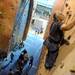 Dexter resident Dave Ramirez, right, climbs up the wall at Planet Rock relying on his arm strength and one leg. Angela J. Cesere | AnnArbor.com