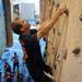  Canton resident Eddie Elinburg relied mostly on his arm strength climbing up the wall at planet rock without his prosthetic legs attached. Angela J. Cesere | AnnArbor.com