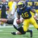 Junior quarterback Denard Robinson dodges a Wester player as he runs down the field during the game against Western Michigan at Michigan Stadium in Ann Arbor, Mich. on Sept. 3, 2011. Angela J. Cesere | AnnArbor.com