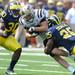 Sophomore safety Thomas Gordon, left, and junior linebacker Kenny Demens, right, take down Western Michigan wide receiver Robert Arnheim during the football game at Michigan Stadium in Ann Arbor, Mich. on Sept. 3, 2011. Angela J. Cesere | AnnArbor.com