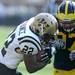 Michigan freshman defensive end Brennen Beyer, right, goes after Western Michigan running back Dareyon Chance during the football game at Michigan Stadium in Ann Arbor, Mich. on Sept. 3, 2011. Angela J. Cesere | AnnArbor.com