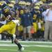 Michigan senior running back Michael Shaw runs the ball down the field to score a touchdown during the football game against Western Michigan at Michigan Stadium in Ann Arbor, Mich. on Sept. 3, 2011. Angela J. Cesere | AnnArbor.com