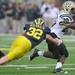 Junior safety Jordan Kovacs gets a hold of  Western Michigan running back Brian Fields during the football game at Michigan Stadium in Ann Arbor, Mich. on Sept. 3, 2011. Angela J. Cesere | AnnArbor.com
