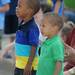 Southfield residents Ryan Richardson, age 3, left, and his brother Colin, age 2, watch the Ypsilanti Fourth of July parade head down Cross St. Angela J. Cesere | AnnArbor.com