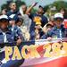 8-year-old Pack 283 Cub Scout members Jordan Embry, left, and Charlie Carter help hold up their sign during the Ypsilanti Fourth of July parade on Cross St.  Angela J. Cesere | AnnArbor.com