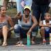 Ypsilanti resident Brianne Richards, center, watches the Ypsilanti Fourth of July parade with her son Semaj Richards, age 9, and daughter Adrienne Lee-Walker, age 13, on Cross St. Wednesday morning.  Angela J. Cesere | AnnArbor.com