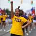 13-year-old Morgan Williams of Ypsilanti High School cheers during the Ypsilanti Fourth of July parade on Cross St. Angela J. Cesere | AnnArbor.com