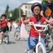 9-year-old Ypsilanti resident Julia Danci rides her bike with the Bike Ypsi group during the Fourth of July parade down Cross St. Wednesday morning. Angela J. Cesere | AnnArbor.com