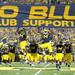 Michigan football players hit the banner on their way out of the tunnel before the football game against Notre Dame on Sept. 10, 2011. Angela J. Cesere | AnnArbor.com