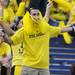 A Michigan fan dances with pompons in the stands during the football game against Notre Dame on Sept. 10, 2011. Angela J. Cesere | AnnArbor.com
