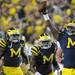 Junior defensive tackle William Campbell (73), right, celebrates after stopping a play during the football game against Notre Dame on Sept. 10, 2011. Angela J. Cesere | AnnArbor.com