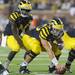 Senior offensive lineman David Molk on the line of scrimmage with junior quarterback Denard Robinson during the football game against Notre Dame on Sept. 10, 2011. Angela J. Cesere | AnnArbor.com