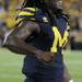 Junior quarterback Denard Robinson cheers after Michigan scored its winning touchdown during the football game against Notre Dame on Sept. 10, 2011. Angela J. Cesere | AnnArbor.com