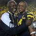 Associate Athletic Director Greg Harden, left, hugs junior wide receiver Roy Roundtree after Michigan defeated Notre Dame 35 - 31 at Michigan Stadium on Sept. 10, 2011. Angela J. Cesere | AnnArbor.com
