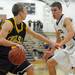 Chelsea's Jack McDougall, left, looks for a way around Dexter's Jacob VanHoof. Angela J. Cesere