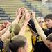 Chelsea head coach Todd Blomquist and team put their hands in to get fired up after a timeout.  Angela J. Cesere