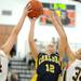 Dexter's Polly Washabaugh, left, and Teia McGahey, right, stop Chelsea's Grace Sauers' shot. Angela J. Cesere