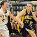 Dexter's Makenzie Svihra, left, tries to block Chelsea's Megan Hall from driving to the basket. Angela J. Cesere