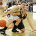 Dexter's Makenzie Svihra, left, and Chelsea's Grace Sauers fight for the ball. Angela J. Cesere