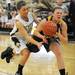 Dexter's Lindsey Lloyd, left, knocks the ball out of the hands of Chelsea's Megan Hall. Angela J. Cesere