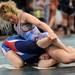 North Carolina girl's team wrestler Madyson Kneer, top, tries to pry apart the arms of Wisconsin girl's team wrestler Jamie Reif during a high school age wrestling match at the United States Girls' Wrestling Association National Championships tournament at Eastern Michigan University. Angela J. Cesere | AnnArbor.com
