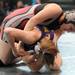 Ohio girls wrestling team member Sierra Volgmare, top, tries to force down New York girls wrestling team member Casey Rue during a  high school age bracket wrestling match at the United States Girls' Wrestling Association National Championships tournament at Eastern Michigan University. Angela J. Cesere | AnnArbor.com