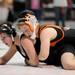 Pennsylvania girls wrestling team member Kat Luteri, right, tries to keep down Ohio girls wrestling team member Kaylee Cast during a high school age bracket wrestling match at the United States Girls' Wrestling Association National Championships tournament at Eastern Michigan University. Angela J. Cesere | AnnArbor.com 