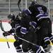  Teammates jump on Pioneer forward Tommy Pokorney after he scored a goal in the first period against Saline. Angela J. Cesere | AnnArbor.com
