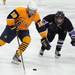 Pioneer defenseman Garrette Helber, right, chases after Saline forward James Olson. Angela J. Cesere | AnnArbor.com
