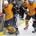 Pioneer defenseman Erik Barroso, holds Saline forward Trevor Carey from the puck.  Angela J. Cesere | AnnArbor.com
