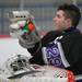  Pioneer goalie Spencer Peck grabs a drink during a time-out. Angela J. Cesere | AnnArbor.com
