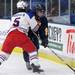 Grosse Pointe Woods University Liggett's Jake Hodges, left, tries to stop Chelsea's Jacob Ryan from skating with the puck during the MHSAA Div. 3 hockey semi-finals game at Compuware Arena in Plymouth, Mich. on Friday afternoon. Angela J. Cesere | AnnArbor.com
