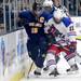 Grosse Pointe Woods University Liggett's James Counsman, right, tries to get the puck from Chelsea's Joe Hewitt. Angela J. Cesere | AnnArbor.com

